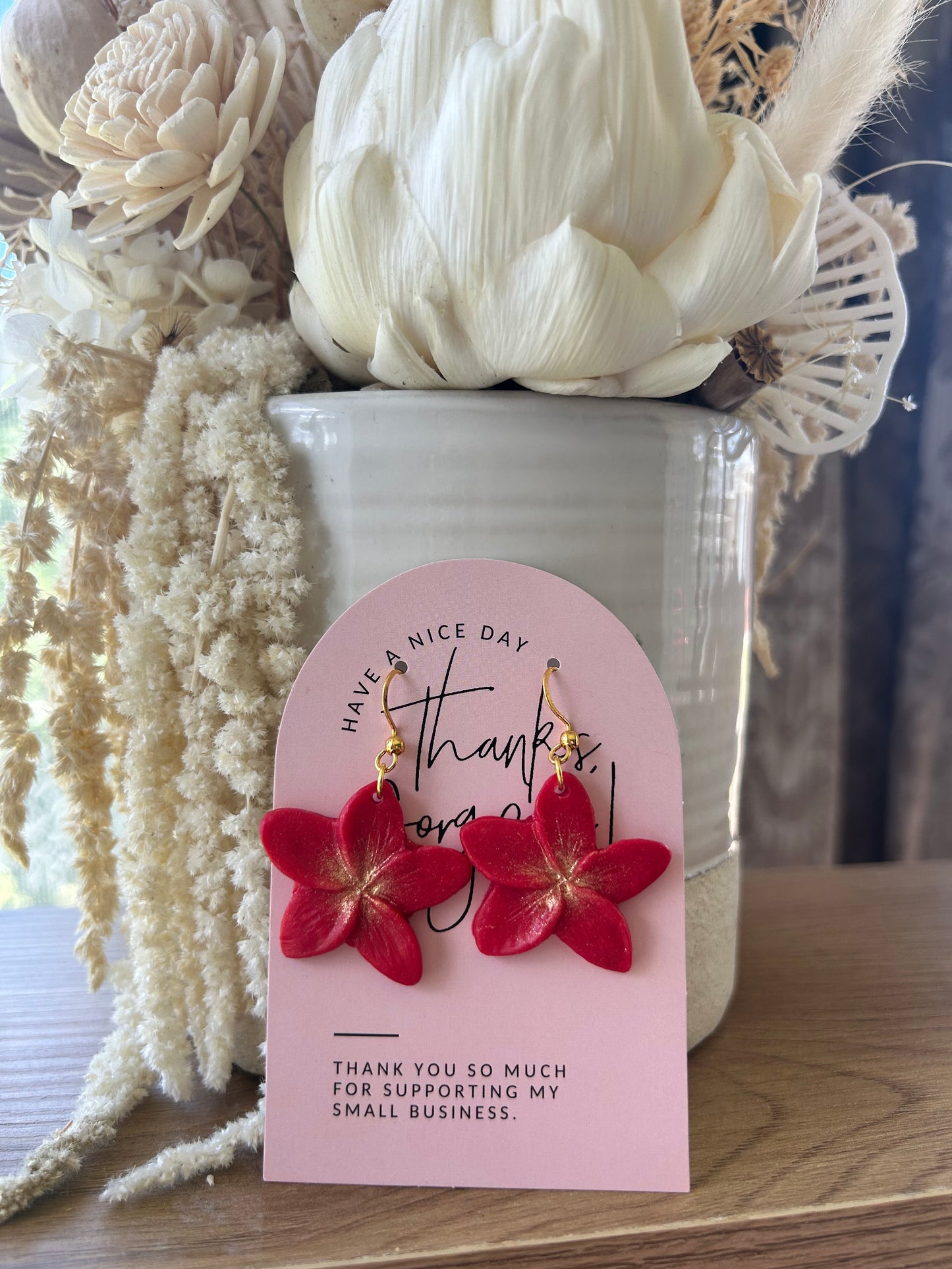 Clay frangipani earrings (red and gold tones)