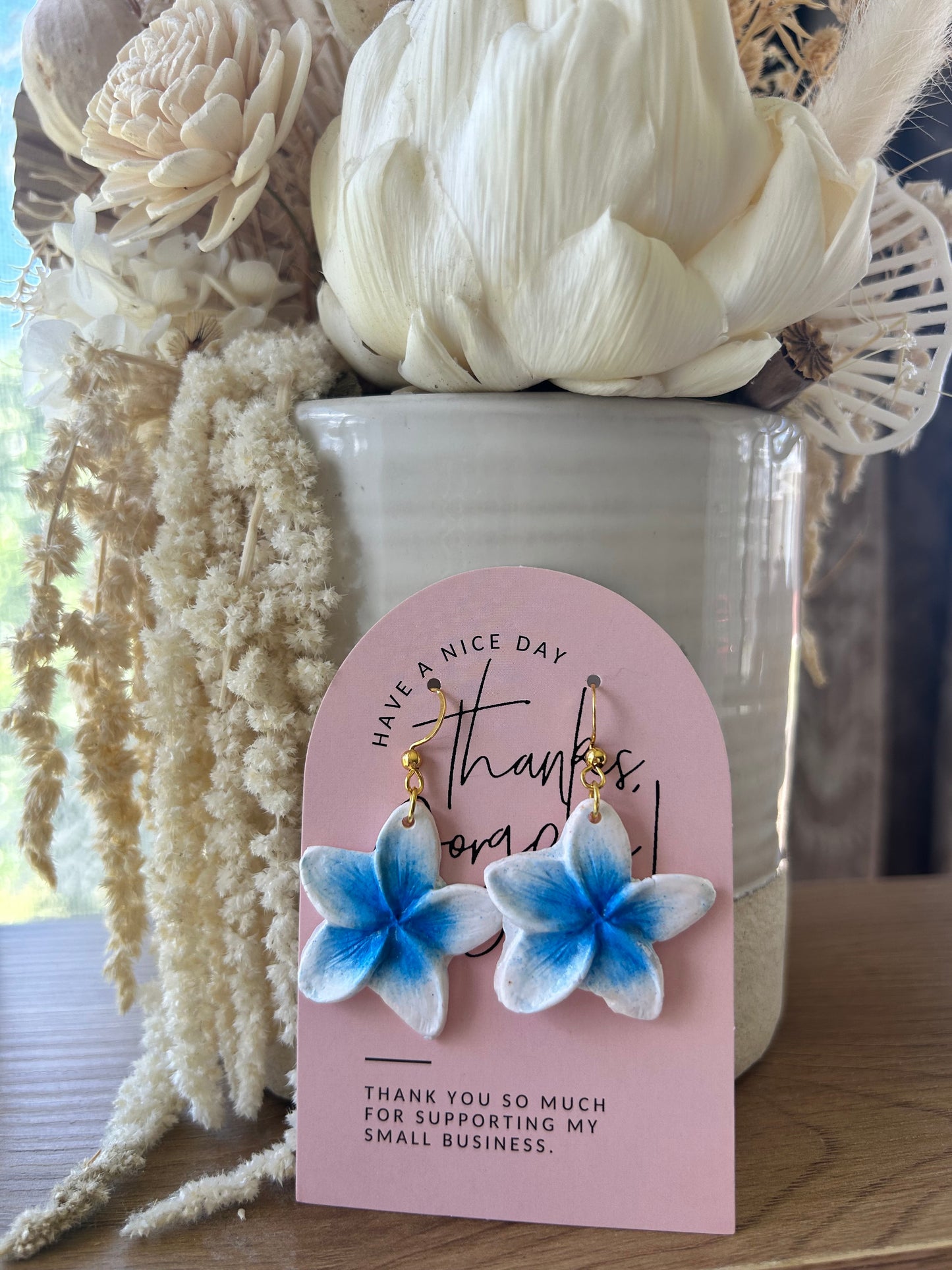 Clay frangipani earrings (blue tones)