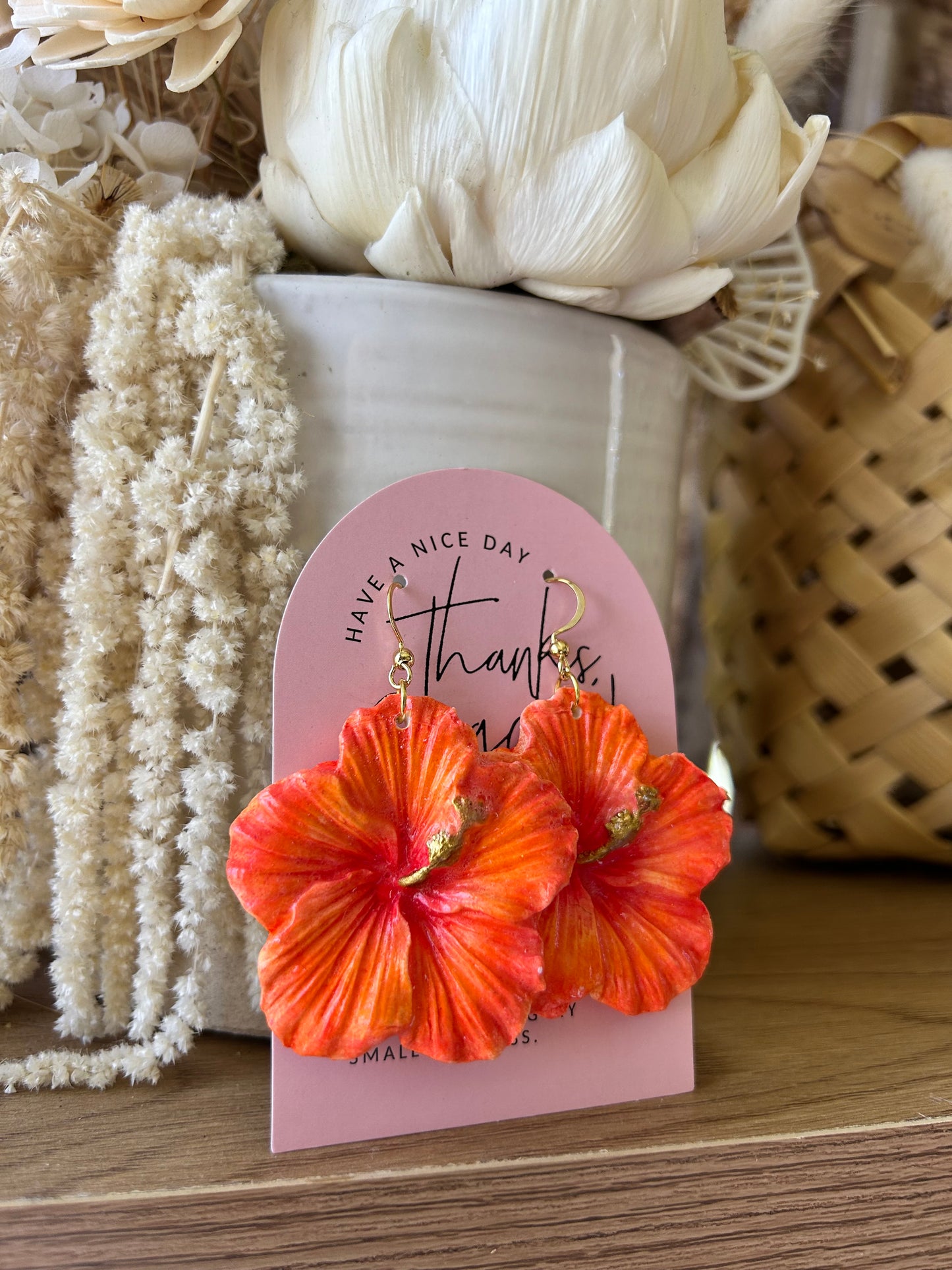 Clay hibiscus earrings (deep orange)